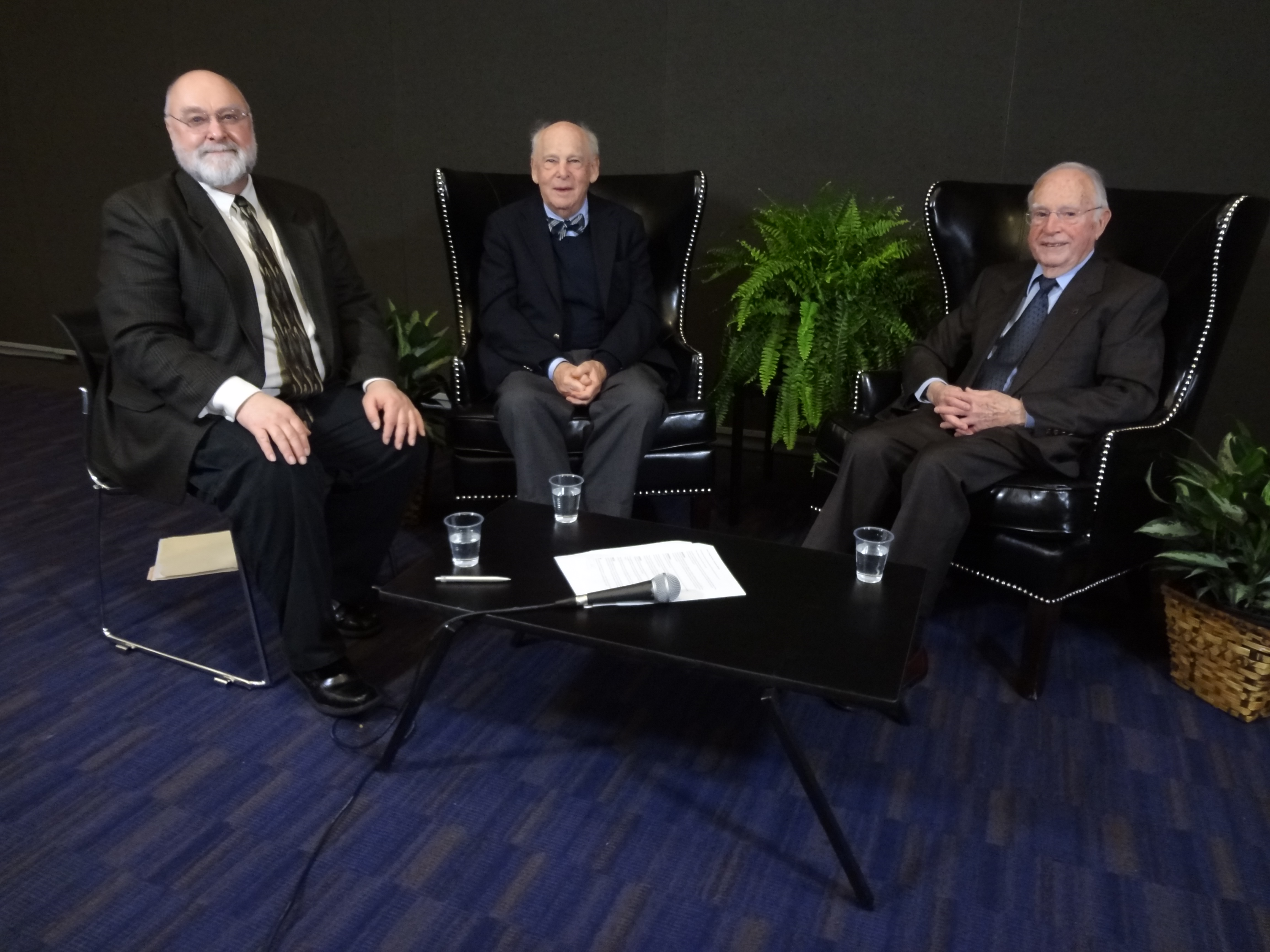 Streeter, Rosenberg, and Kittredge sitting in black armchairs smiling
